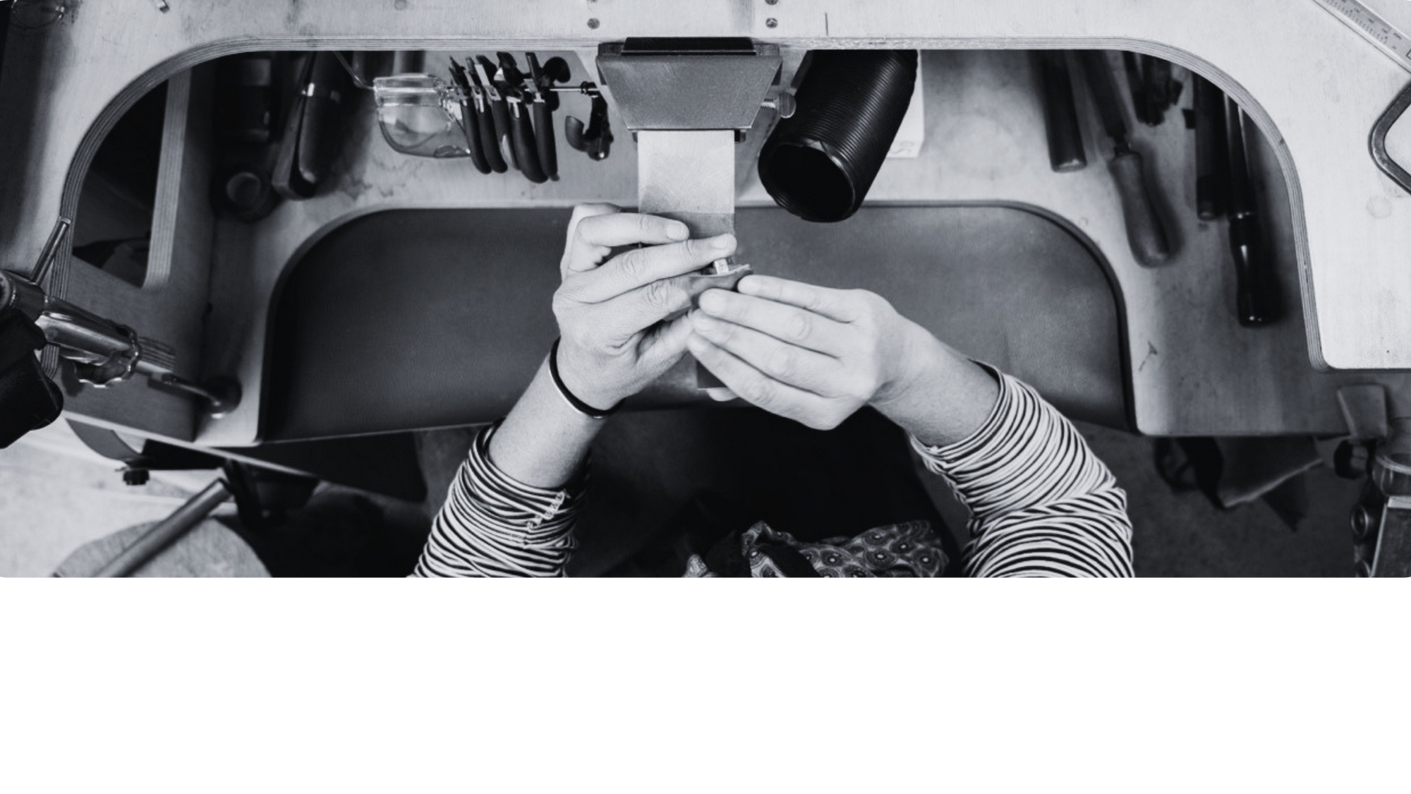 Person sanding a wedding ring in their gold workshop
